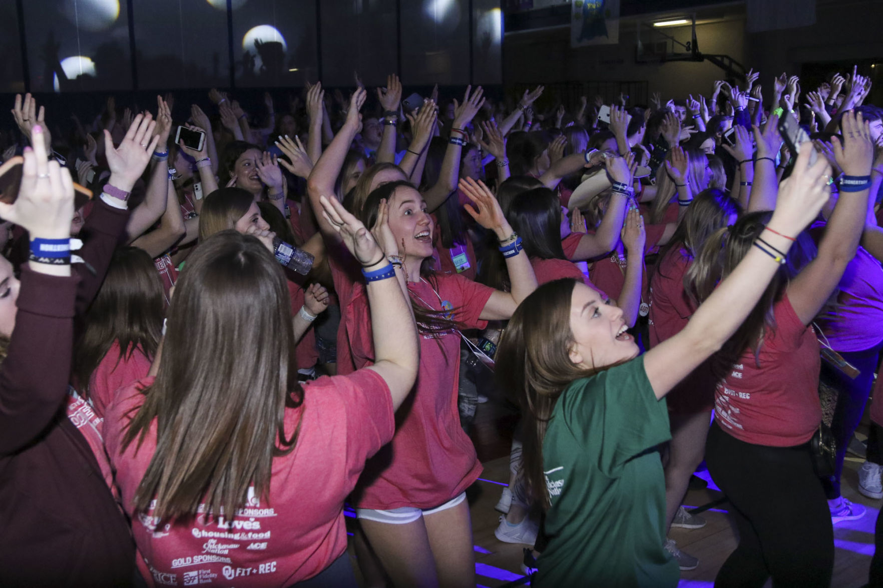 Students dance and sing
